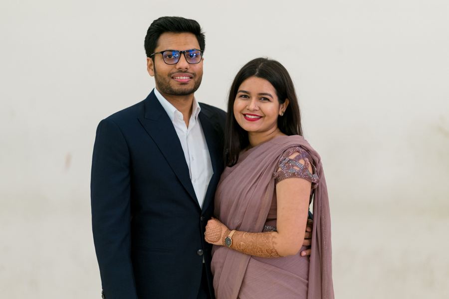 A smiling couple in formal clothes